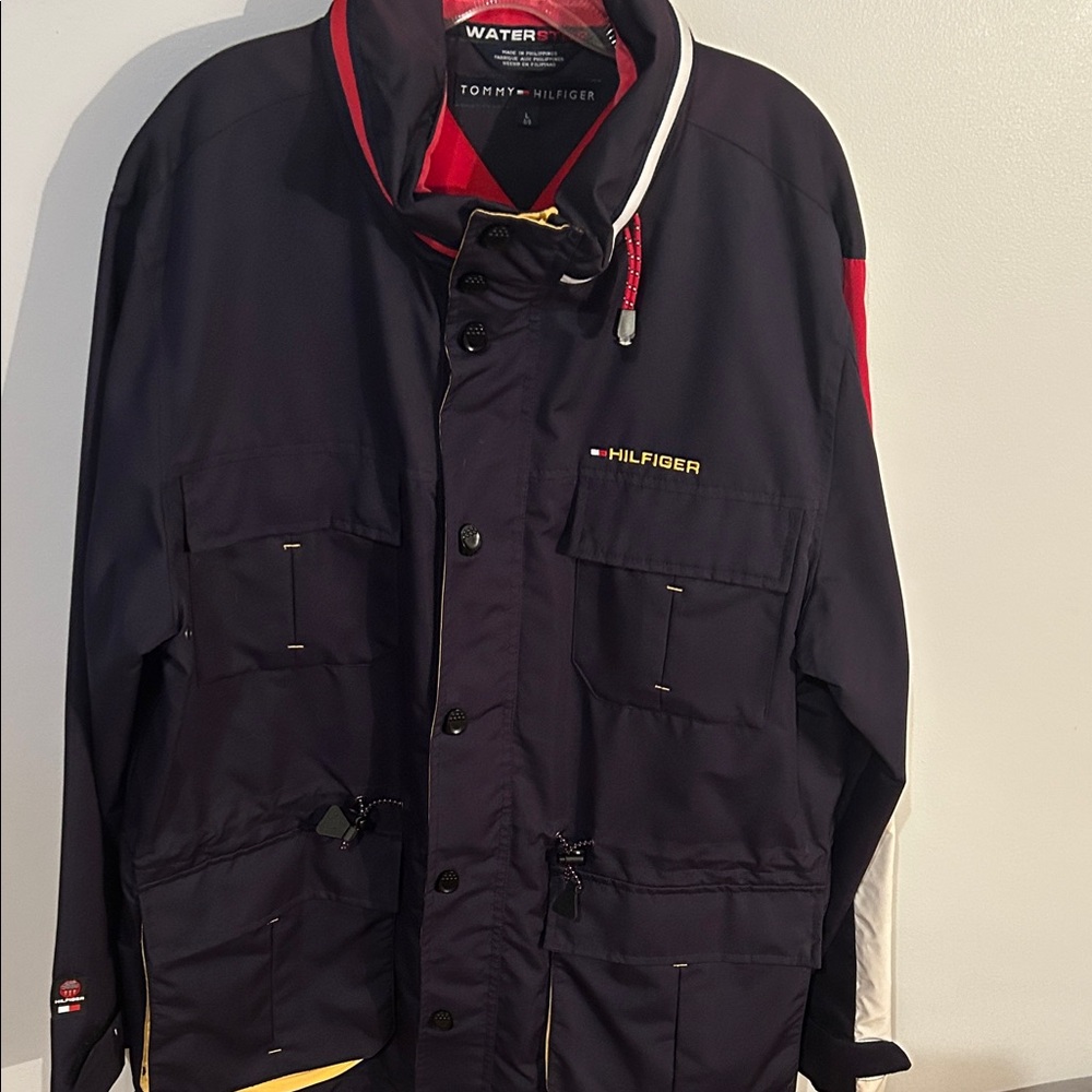 Tommy Hilfiger Men's Black coat , zipper to tuck hood away with Red Accents